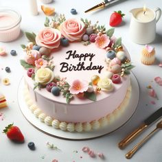 a birthday cake decorated with flowers and berries