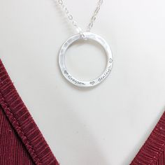 Add a touch of elegance and personalization to your jewelry collection with our stunning .925 sterling silver hammered circle necklace. This exquisite piece is meticulously handcrafted with care, showcasing a unique hammered texture that adds a hint of individuality and charm. What truly sets this necklace apart is the option to have it custom engraved with names of your choice. Whether it's the names of your loved ones, your children, or a word that holds special meaning to you, our skilled art Sterling Silver Hammered Necklaces For Anniversary, Hammered Sterling Silver Necklaces For Anniversary, Sterling Silver Hammered Necklace For Anniversary, Anniversary Sterling Silver Hammered Necklace, Silver Hammered Necklace For Anniversary, Silver Hand-stamped Round Pendant Jewelry, Silver Hand Stamped Round Pendant Jewelry, Sterling Silver Hammered Jewelry Gift, Sterling Silver Full Circle Necklace For Anniversary