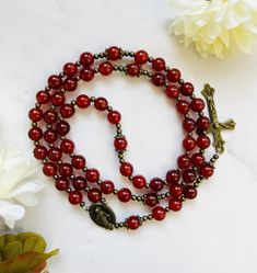 "This beautiful rosary is made of Natural Red Agate Gemstone Beads  They are available with brass, silver accent.  The listing sample photos are with brass and silver accent.  Materials:  * 8mm Red Agate Semi-precious stone beads * spacer beads and bead caps * Centerpiece and Crucifix  For personalization: 💛  If you want to change the centerpiece and crucifix, please mention its number in the \"Personalization box\", otherwise I will make your rosary same as in the listing pictures.  ❤️ Name/in Beautiful Rosary, Personalized Rosary, First Communion Gifts, Communion Gifts, Confirmation Gifts, Letter Beads, Christening Gifts, Red Agate, Gold Accent