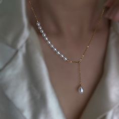 💖 Elevate your style with our exquisite Drop Pearl Pendant Necklace, a stunning addition to any outfit. Handcrafted with care, this necklace features a lustrous freshwater pearl delicately suspended from a 14K gold filled chain. Its adjustable design ensures the perfect fit, making it an ideal choice for any occasion, from casual outings to elegant soirées. ️ Perfect for weddings, this timeless piece adds a touch of sophistication to the bride's ensemble, enhancing her natural beauty with its c Elegant Pearl White Lariat Jewelry, Fine Jewelry Necklace With Adjustable Chain For Wedding, Fine Jewelry Wedding Necklace With Adjustable Chain, White Drop Jewelry With Elegant Design, Wedding Fine Jewelry Necklace With Adjustable Chain, Elegant Adjustable Necklace For Anniversary, Elegant Teardrop Pearl Necklace With Adjustable Chain, Delicate Adjustable White Drop Necklace, Delicate White Adjustable Drop Necklace