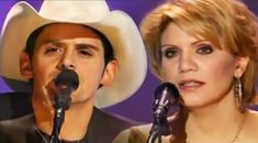 a man in a cowboy hat standing next to a woman with a microphone on stage