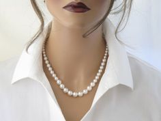 This simple Swarovski pearl necklace features graduated pearls ranging in size from 6mm up to 10mm.Measures 17 inches in length + a 2 inch extender chain.Items arrive in a beautiful hand decorated gift box.Ready to ship in 3-5 business days.To view the coordinating earrings:  https://www.etsy.com/listing/228938798/swarovski-pearl-studs-bridesmaid-gift?ref=shop_home_active_18 16 Inch Round Elegant Pearl Necklace, Elegant 16 Inch Round Pearl Necklace, Elegant 16 Inch Pearl Necklace For Formal Occasions, Elegant Formal Pearl Necklace 16 Inch, Elegant 16 Inch Pearl Necklace Gift, Elegant 16-inch Pearl Necklace Gift, Elegant White 16 Inch Pearl Necklace, Elegant 16 Inch Silver Pearl Necklace, Elegant Beaded Necklaces 16 Inch Length