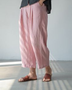 "Stay cool and comfortable this summer with our lightweight linen cropped pants. These simple and relaxed wide-leg pants are perfect for the warm weather. Crafted from breathable linen fabric, they offer a loose and airy fit that allows for easy movement. The cropped length adds a trendy touch, while the wide-leg design provides a relaxed and laid-back vibe. Whether you're lounging at home or strolling along the beach, these pants are a must-have for your summer wardrobe. Embrace simplicity and style with our summer linen cropped pants. SIZE LIST Normal: Waist:72CM/28.3\" Hips:112CM/44.1\" length:90CM/35.4\" Shipping Policies: All orders will take the fastest express delivery no extra shipping. Usually 10-15 days to arrive US. To Europe usually 8-12 days. Other countries usually 10-15 days Relaxed Baggy Harem Pants For Spring, Comfortable Linen Wide Leg Pants For Spring, Relaxed Baggy Bottoms For Summer, Pink Relaxed Fit Bottoms, Comfortable Pink Summer Pants, Comfortable Ankle-length Spring Pants, Comfortable Linen Harem Pants For Spring, Comfortable Loose Fit Linen Harem Pants, Spring Linen Harem Pants With Pockets