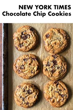 new york times chocolate chip cookies on a baking sheet with text overlay that reads, new york times chocolate chip cookies