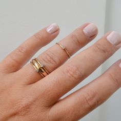 A super cute, minimalist CZ stone ring gives you that barely there feel, with a touch of sparkle. Looks great alone or added to your daily stack! 14K Gold Filled Band is 1mm, CZ stone is 2mm Listing is for ONE RING Gold Filled has 100 times more gold than gold plated jewelry and will not chip or fade with wear! You can swim/shower, etc just like you would with solid gold. Gold filled wire is created by taking a sheet of 14 karat gold and bonding it through extreme heat and pressure to a core of Dainty Initial Ring With Round Band For Everyday, Dainty Everyday Initial Ring With Round Band, Gold Dainty Crystal Ring With Simple Design, Everyday Simple Gold Birthstone Ring, Dainty Rose Gold Initial Ring, Dainty Yellow Gold Stackable Rings, Dainty Stackable Crystal Open Ring, Dainty Midi Rings With Single Diamond For Everyday, Dainty Midi Rings With Single Diamond For Gift