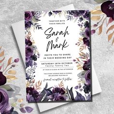 wedding card with purple flowers and greenery