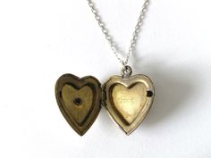 This vintage sweetheart necklace bears a US Navy insignia on a heart-shaped locket. The locket is hallmarked 10K gold-filled sterling from D'Aguanno Bros. The chain is a new, 14K gold-filled, and measures 18 inches. This piece has been restored as close as possible to its original condition, cleaned gently by hand with steam, polishing cloths, and good old-fashioned elbow grease.This vintage item has been loved and cherished by a previous owner, there will be some slight wear or imperfections. I Personalized Vintage Heart Necklace For Valentine's Day, Vintage Heart Charm Necklace For Valentine's Day, Vintage Charm Heart Necklace For Anniversary, Vintage Pendant Locket Necklace For Valentine's Day, Vintage Heart Necklace With Vintage Charm For Anniversary, Vintage Heart Necklace With Charm For Anniversary, Vintage Heart Charm Necklace, Heart Shaped Vintage Charm Necklace For Anniversary, Vintage Heart-shaped Necklace For Gift