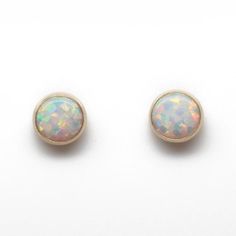 These opal stud earrings are beautiful.  They feature a single 6mm simulated opal cabochons.  Hand bezel set in my studio.  • 6mm Simulated Opal Round Cabochons• 14k Gold Filled or 925 Sterling SilverThey will arrive carefully packaged in a signature kraft gift box. Check out all of my opal earrings: https://www.etsy.com/shop/KMBankston/search?search_query=opal+earring&order=date_desc&view_type=gallery&ref=shop_search~About Me:My name is Kathy Bankston, and I am a metalsmith and lampwork bead ma Opal Earring, Opal Stud Earrings, Opal Earrings Stud, Opal Studs, Opal Earrings, Seed Bead Jewelry, Opal Jewelry, Post Earrings, Gold Filled