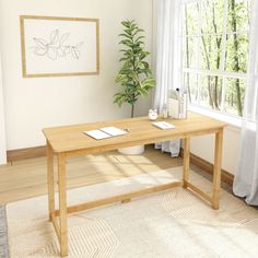 a wooden table sitting in front of a window next to a potted plant on top of a rug