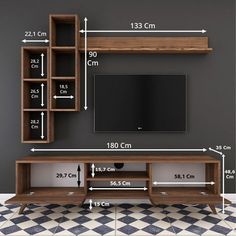 an entertainment center is shown with measurements for the wall mounted tv and shelving unit