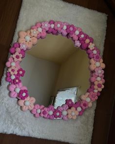 a mirror with pink and white flowers on it