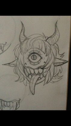 a drawing of an evil looking demon with horns and fangs on it's face