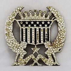 Vintage Belt Buckle 2004 Cadillac Emblem American Flag Crown Mud Flap Girls Women Rhinestones USA Made By Silver Star The Originator Not The Imitator. Normal wear and tear due to age and use. This vintage belt buckle is a valuable addition to any collector's collection. It is a stunning representation of fashion history with intricate design elements and burnished metal. Its weighty construction and versatility make it a standout piece that will never go out of style. A must-have for collectors, this vintage belt buckle is a timeless treasure. Vintage Belt Buckles, Vintage Belt, Vintage Belts, Suspender Belt, Timeless Treasures, Silver Stars, Fashion History, Out Of Style, Belt Buckle