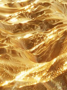 an abstract gold background with waves and sparkles on the surface, as seen from above