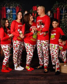 Celebrate the magic of the season with our Merry Grinchmas Family Matching Pajama Set! This delightful set features a vibrant red top showcasing a playful holiday graphic that reads "Merry Grinchmas," perfect for spreading cheer. The coordinating pants boast a white base adorned with whimsical holiday characters, making it an ideal choice for family gatherings, cozy movie nights, or festive celebrations. Key Features: Soft and Comfortable: Crafted from a cozy cotton blend, these pajamas provide Family Holiday Pajamas, Holiday Characters, Matching Pajama Set, Christmas Pajamas Kids, Matching Pajama, Merry Grinchmas, Patterned Pants, Matching Christmas Pajamas, Movie Nights