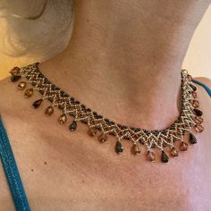 "I call this collar style 'Egyptian Lace,' which seems to sum up the differing elements that make this such a beautifully delicate necklace.  Gold, bronze, and brown seed and drop beads for a Fall aesthetic.  Clasp is gold-plated. Length is approximately 17.25\" including clasp. If you are seeking something specific, let me know - custom orders are a delight! I want you to be happy with your order, so I do accept returns provided the item is unused and in it's original condition.  Please let me know within three days of receipt.  Return postage will be the buyer's responsibility." Bohemian Teardrop Beaded Necklaces For Jewelry Making, Bohemian Teardrop Beaded Necklace For Jewelry Making, Bohemian Teardrop Beads For Jewelry Making, Gold Teardrop Beaded Necklaces With Dangling Beads, Gold Teardrop Beaded Necklace With Dangling Beads, Brown Beaded Teardrop Jewelry, Adjustable Beaded Teardrop Crystal Necklace, Beaded Teardrop Brown Necklace, Brown Beaded Teardrop Necklace