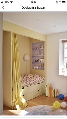 a small bedroom with yellow curtains and white bedding, in front of a window