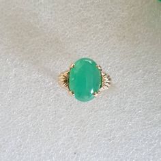 Chrysoprase Cabochon ring, Chrysoprase ring, Chrysoprase and gold ring, Cabochon Chrysoprase in 10 carat yellow gold. Chrysoprase weighs 5 carats Chrysoprase measures 14x10mms The ring is in 10 carat yellow gold Ring size is M 1/5 (Australian size) or 6 1/4 (US size). Ring is ready to ship in 1-2 working days.  We resize free of charge.  Please allow a couple of additional days for resizing. All my rings come in a velvet ring box.  I am highly conscious of environmental damage that extra packagi Heirloom Green Emerald Oval Cabochon Ring, Heirloom Green Oval Cabochon Emerald Ring, Green Opal Oval Ring In 14k Gold, Classic Green Oval Opal Ring, Yellow Gold Jade Cabochon Ring, Green Emerald Cabochon Rings, Classic Round Chrysoprase Rings, Classic Green Cabochon Emerald Ring, Heirloom Green Oval Opal Ring