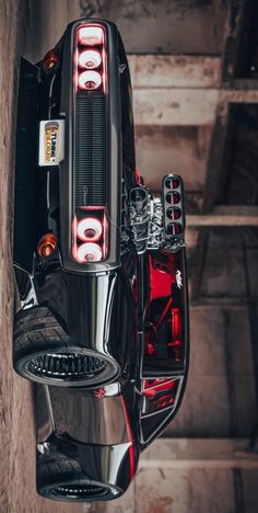 the rear end of a motorcycle parked in a garage