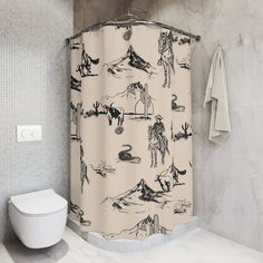 a bathroom with a shower curtain that has drawings on it and a toilet in the background