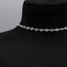 Coffee Bean Chain (Also known as the Mariner Link) A stunning minimalist stainless steel choker. 5mm x 6mm Width Stainless Coffee Bean Chain 4 Inch 4.7mm Stainless Steel Adjuster Chain Hand Made in the UK Sizing: Small 11 - 15 Inches (28cm - 38cm) Medium 13 - 17 Inches (33cm - 43cm) Large 15 - 19 Inches (38cm - 48.5cm) Silver Stainless Steel Choker With Adjustable Chain, Silver Stainless Steel Choker With Clavicle Chain, Silver Stainless Steel Oval Link Chain Necklace, Modern Stainless Steel Chain Choker Necklace, Modern Stainless Steel Choker Chain Necklace, Modern Stainless Steel Chain Choker, Minimalist Silver Choker With Adjustable Chain, Silver Minimalist Choker With Adjustable Chain, Minimalist Silver Choker With Lobster Clasp