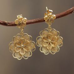 Crafted of sterling silver filigree and bathed in 21k gold roses becomes a lacy feminine earrings. Giuliana Valz-Gen crafts the dazzling flower earrings by hand. .925 Sterling silver Flower Earrings Dangle, Gold Flower Earrings, Gold Jhumka Earrings, Filigree Jewelry, Gold Chains For Men, Gold Jewelry Earrings, Bridal Gold Jewellery Designs, Gold Earrings Designs, Gold Necklace Designs