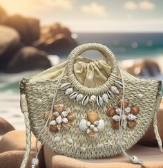 This elegant beach handbag is perfect for an outfit or to go out for dinner. You will get many compliments.  Great for gift giving  It is 100% handmade. Straw material Comes with a removable chain. Size  Bag Length:13 inch, Bag Width:3.1 inch, Bag Height:8.3 inch, Handle Height:3.9 inch, Strap Length:47.2 Sand-colored Straw Bag For Summer Beach, Beachy Sand-colored Straw Bag, Summer Sand-colored Straw Bag, Summer Beach Shoulder Bag Made From Palm Leaf, Summer Vacation Sand Crochet Bag, Sand-colored Crochet Bag For Summer Vacation, Summer Vacation Crochet Bag In Sand Color, Summer Beach Bags Made Of Shell, Summer Tote Bag Fashion Accessory