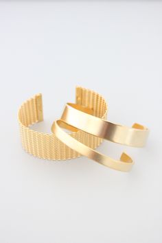 18k gold plated brass cuff. 1/4 inch wide. Luxury Gold Plated Cuff Bracelet With Polished Finish, Luxury Gold Metal Cuff Bracelet, Elegant Gold Brass Cuff Bracelet, Elegant Yellow Gold Brass Cuff Bracelet, Gold-plated Polished Cuff Bracelet For Formal Occasions, Luxury Gold Bracelet With Open Band, Formal Gold Plated Cuff Bracelet With Polished Finish, Luxury Gold Open Cuff Bangle, Luxury Yellow Gold Metal Cuff Bracelet