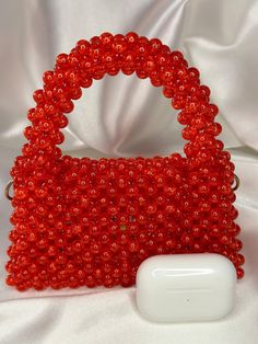 The model of the bag SCARLET HOPE has a deeply piercing red-scarlet shade of beads. This noble color of the bag will go well with any day or evening look. Handmade beaded handbag Material: acrylic Base to top of handle: 16cm Width: 5cm Height: 15cm Included with the bag is a metal chain of 1 m Bag with magnetic closure These option are perfect because if you wear a simple outfit, you can dress it up completely by adding a little bag that packs a big punch. Because of its unique shape, it's the p Red Beaded Bag As Gift, Red Beaded Bag For Gift, Red Beaded Rectangular Evening Bag, Elegant Red Beaded Bag, Elegant Red Beaded Shoulder Bag, Red Clutch Evening Bag, Red Beaded Evening Bag As Gift, Red Beaded Rectangular Shoulder Bag, Everyday Red Beaded Bags