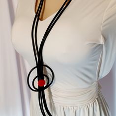 This Necklace Is Absolutely Stunning Handmade Super Light And Delicate Made With Rubber And Red Wooden Beads Hangs 28 Inches A Statement Piece So Unique And Eye Catching Picasso Vibes Are All Over This Necklace One Of A Kind Piece. Elegant Handmade Black Long Necklace, Handmade Circular Black Necklaces, Handmade Circular Black Necklace, Handmade Black Circle Necklaces, Handmade Black Circle Necklace, Black Long Necklace Gift, Handmade Black Circular Jewelry, Black Lariat Long Necklace Gift, Black Lariat Long Necklace For Gift