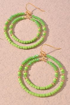 Go out of your way to bring a bit of pizzazz to any look with these Circle Duo Beaded Earrings in a vibrant lime hue. Made with intricately-beaded circles, these lightweight earrings will have you dreaming up all sorts of stylish combinations! (And yes, they'll make 'em lime with envy!) Trendy Green Jewelry With Faceted Beads, Green Round Beads Jewelry For Summer, Summer Green Jewelry With Round Beads, Trendy Green Beaded Drop Earrings, Colorful Beaded Circle Earrings For Summer, Trendy Green Beaded Dangle Earrings, Green Beaded Earrings For Summer, Green Hoop Earrings For Summer Party, Green Jewelry With Colorful Beads For Summer