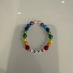 Handmade Beaded Bracelet That Says Love Make An Offer Casual Rainbow Beaded Bracelets With Letter Beads, Casual Personalized Rainbow Beaded Bracelet, Casual Rainbow Bracelets With 8mm Beads, Casual Pearl Bracelet With Letter Beads As Gift, Casual Pearl Bracelet With Letter Beads For Gift, Casual Pearl Bracelet With Colorful Beads, Bracelets Handmade Beaded, Womens Jewelry Bracelets, Beaded Bracelet