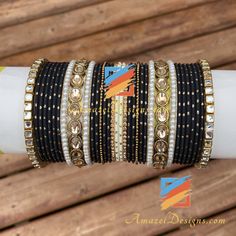 Golden Black Polki Kundan Bangle Set can be customized with any Bangle or Kada. - Talk to us to Add or Remove any bangle and adjust pricing. - Price shown is for Both Hands Explore more INDIAN BANGLES, Indian Kada, CHURA, Bridal Kada 👉 PUNJABI BRIDAL JEWELLERY ONLINE 💁🏻‍♀️Kamalika, US ⭐️⭐️⭐️⭐️⭐️ Great collection. Prompt delivery. Exceeded my expectations- more beautiful than the picture. Love the packaging which comes with a 'Thank You' note. Great customer care. Very happy with whatever I pu Traditional Black Bracelets For Party, Traditional Black Party Bracelets, Handmade Adjustable Black Bangle, Adjustable Handmade Black Bangle, Black Bracelets For Festivals, Adjustable Black Handmade Bangle, Black Festive Bracelets For Festivals, Traditional Black Bracelets For Weddings, Traditional Black Bracelet For Wedding