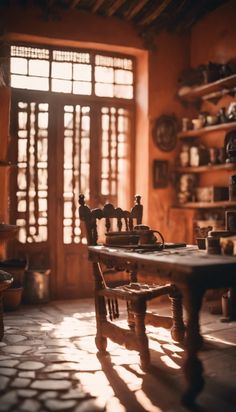 an old fashioned table and chairs in a room with wooden shelves filled with pottery on the wall