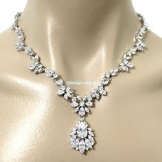 "A piece of woodland wedding nature inspired statement bridal necklace featuring vines, leaves parts and flower pendant, made of sparkly clear cubic zirconia. This beautiful cz jewelry comes in tarnish-resistant silver rhodium plated chain. Necklace length options: - 17\" (43cm) with a snap clasp - 19\" (48cm) including a 2\" chain extender on a spring clasp (as shown on display). View matching pieces or similar designs at https://etsy.me/2eR38KG View designs related to vines, branches, twigs or Glamorous Sparkling Cubic Zirconia Bridal Necklace, Sparkling Silver Diamond Necklace For Wedding, Silver Sparkling Diamond Necklace For Weddings, Classic Diamond Necklace With Rhinestones For Wedding, Classic Rhinestone Diamond Necklace For Wedding, Classic Wedding Diamond Necklace With Rhinestones, Wedding Crystal Diamond Necklace, Wedding Crystal Diamond Necklace With Sparkling Detail, Wedding Crystal Diamond Necklace Sparkling