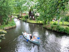 people are in a canoe on the river