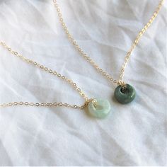 Wear your luck! Jade is the stone of good fortune. 10mm ring in light or dark green jade 14kt gold filled or sterling silver dainty link necklace The dark green is a thicker ring.