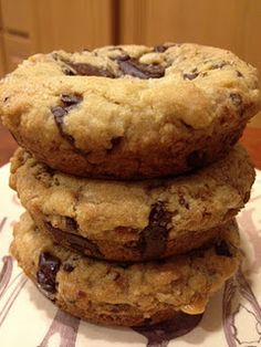 three chocolate chip cookies stacked on top of each other