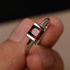 This is a gorgeous handmade creation. Its beauty is its simplicity & Elegance. The 6*6 mm Princess cut garnet (about 1.51 ct) is crafted in solid sterling silver or 14k white/rose/yellow gold All item is sent in a beautiful gift box If you have any idea of design your ring,pls contact me directly. You can realize more lovely stuff clicking the link https://www.etsy.com/shop/knightjewelry?refshopsection_shophome_leftnav Please leave the correct address and you phone number for delivering succ Jewelry Princess, Rings White Gold, Rings Red, Cut Rings, Red Gemstone Ring, Jewelry Knowledge, January Birthstone Jewelry, Red Garnet Ring, Rings Etsy