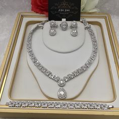 Sparkle and shine like never before with the range of cz diamond cubic zirconia silver plated bridal necklace set with matching earrings. This beautiful cubic zirconia encrusted necklace set is the perfect accessory  for your wedding day. Beautiful elegant, this silver cubic zirconia necklace set is filled with the dazzling sparkle. Guaranteed to transform your look in seconds to gain instant luxury, this stunning necklace set will ensure you steal every spotlight. Bring the dazzle into your out Cubic Zirconia Jewelry Sets For Anniversary, Wedding Jewelry Sets In White Gold With Diamond Accents, Silver Bridal Sets With Diamond Accents, Formal Silver Cubic Zirconia Bridal Sets, Anniversary Diamond Cut Cubic Zirconia Jewelry Sets, Brilliant Cut Crystal Jewelry Sets For Anniversary, Anniversary Jewelry Sets With Diamond-cut Cubic Zirconia, Anniversary Jewelry Sets With Brilliant Cut Crystals, Diamond White Brilliant Cut Jewelry Sets For Wedding