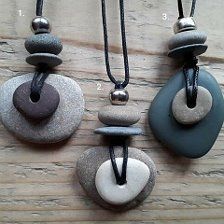 three necklaces with different shapes and colors