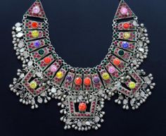 This ornate silver Afghan wedding necklace was handcrafted during the mid-1900's in the Sindh Valley of Central Asia. It is collectible vintage tribal jewelry - not a new reproduction. MEASUREMENTS (1 inch = 2.54 cm): Size = 18 inches on manikin, can be hooked shorter Front Drop = 3 inches (distance between upper/lower edges at center front) Weight = 147.4 grams (5.2 oz) Shipping weight = 11 oz TM Image library = 5-11-2021 Large elaborate necklaces like this one were worn at important celebratio Bohemian Necklace With Silver Beads For Ceremonial Use, Bohemian Jewelry For Traditional Ceremonies, Handmade Jewelry For Traditional Ceremonies And Festivals, Bohemian Heavy Ceremonial Jewelry, Festival Silver Necklace With Jewels, Traditional Jewelry With Intricate Design For Ceremonies, Traditional Jewelry For Ceremonies With Intricate Design, Bohemian Silver Choker With Jewels, Traditional One-of-a-kind Necklace For Festival