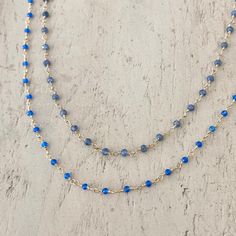 Tiny beads necklace rosary style with either blue chalcedony or sapphire. Length Blue Chalcedony 18" Length Sapphire 19" Blue Sapphire crystals have an excellent energy within the throat chakra to aid your communication ability. Blue chalcedony energies mainly focus on your throat and enables you to speak freely. -This information is intended for spiritual support only Chalcedony beads 3mm Sapphire 3-3.5mm Wire & Findings 14K GF Blue Dainty Crystal Necklace With Gemstone Beads, Blue Faceted Round Bead Crystal Necklace, Blue Tanzanite Gemstone Beads Necklace, Blue Beaded Chalcedony Necklace, Blue Chalcedony Spiritual Necklace, Tiny Beads, Gem Necklace, Throat Chakra, Blue Chalcedony