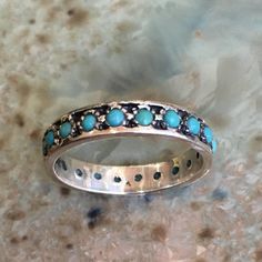 La la land This is a lovely multistone sterling silver eternity band with turquoise stones. if you wish to set different stones just let us know.(R2560) Construction & Dimensions: sterling silver, turquoise Approximate width: 4mm please indicate your requested size in the order. About our jewelry All of artisanfield jewelry collection is handmade. We make the artisanfield designs from a goldfilled wire. *If, for any reason, you are not completely satisfied, please message us so we can try to Turquoise Sterling Silver Jewelry For Promise, Promise Ring In Turquoise Sterling Silver, Silver Stackable Turquoise Ring For Anniversary, Turquoise Round Band Ring For Anniversary, Elegant Turquoise Stackable Rings, Turquoise Stackable Round Band Rings, Stackable Sterling Silver Turquoise Ring For Wedding, Sterling Silver Stackable Turquoise Ring For Wedding, Wedding Stackable Turquoise Ring In Sterling Silver