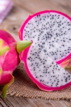 the dragon fruit is cut in half and ready to be eaten