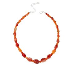 Jay King Sterling Silver Tangerine Chalcedony Bead 18" Necklace Tangerine chalcedony in varying shades of orange, give this handcrafted beaded necklace a fun, festive vibe. From Jay King.       Approx. 18"L x 1/2"W with 2-3/4" extender     Stamped .925     Hook closure     Gemstone bead necklace comprised of freeform and round multi-hued orange chalcedony beads   Stone Information       All sizes and weights approximate     Stabilized Tangerine Chalcedony - Freeform (7x10mm to 14x16mm), round (6 Artisan Single Strand Orange Beaded Necklace, Orange Oval Beaded Necklaces As Gifts, Orange Oval Beaded Necklace For Gifting, Orange Oval Beaded Necklace For Gift, Orange Single Strand Beaded Necklace With Round Beads, Artisan Amber Necklace Single Strand, Artisan Adjustable Orange Necklace, Artisan Amber Single Strand Necklace, Adjustable Orange Artisan Necklace