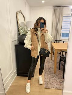 Crop Tops Winter Outfits, Outfits With Tan Vests For Women, Athleisure Vest Outfits, Italy In The Winter Outfits, Fall Outfit With Vest, Puffer Vest Winter Outfit, Winter Outfits With Vest, Mountain Trip Outfit Winter, Tennessee Outfits Winter