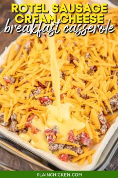 a casserole dish with cheese being poured onto it and the words, rotel sausage cream cheese breakfast casserole