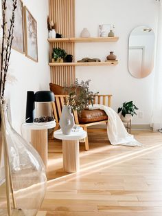 a living room filled with furniture and wooden shelves