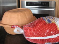 a large bag of chips sitting on top of a counter next to a microwave oven